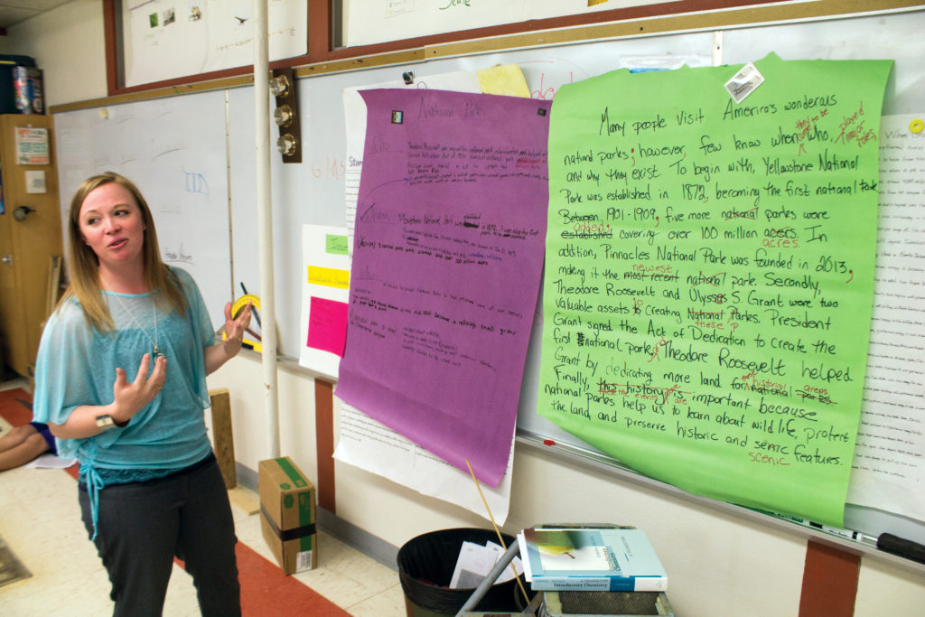 Gretchen Flatz, left, a science teacher at Scranton School, was a self-proclaimed poor writer until she learned the concepts of Step Up to Writing. She displays some of her students work using Step Up to Writing. (Pioneer Photo by Bryce Martin)