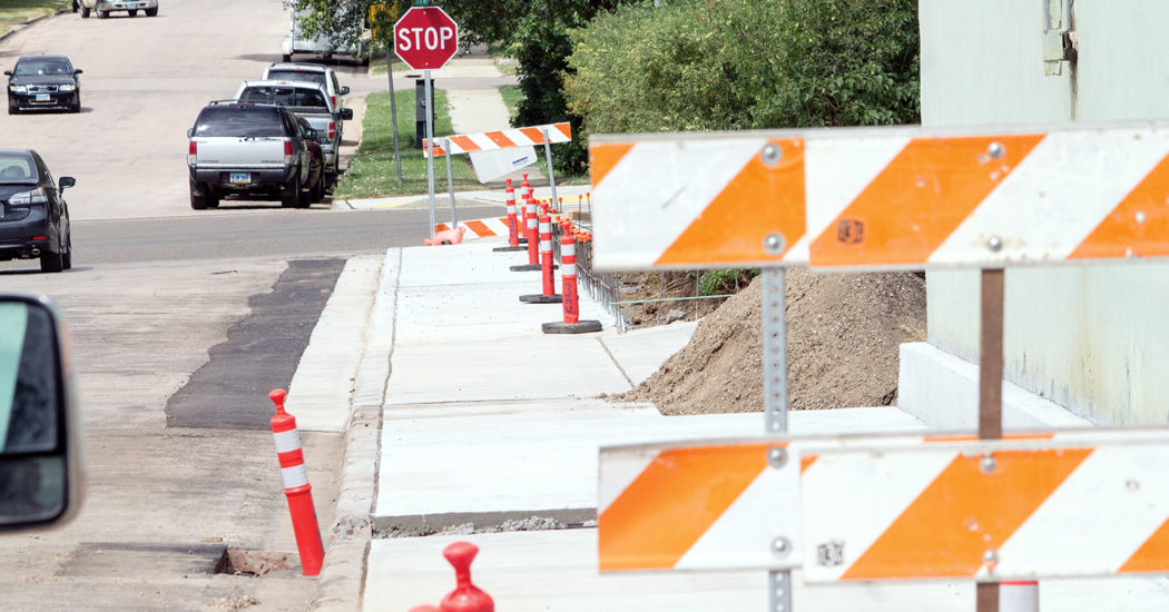 The city is nearly finished with the rehabilitation and addition of sidewalks along the north side of First Street near downtown in Bowman. (Pioneer Photo by Bryce Martin)
